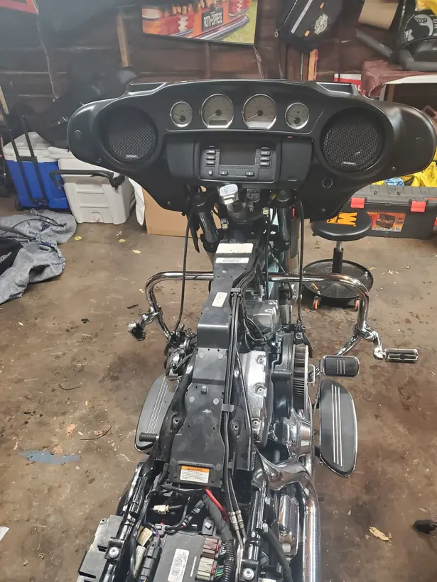 Harley bagger stripped with the inner fairing and wiring exposed