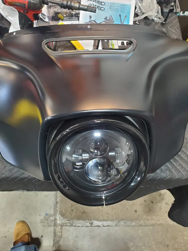 Batwing fairing on the bench with an LED headlight fitted