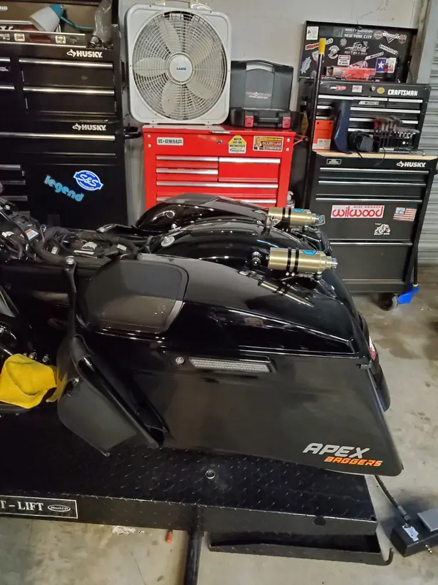 Harley saddlebag and fender on the lift with new rear suspension fitted