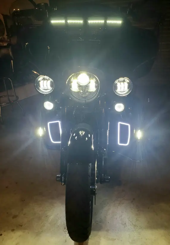 Harley Ultra Limited at night with LED headlight, fog lights and light bar on