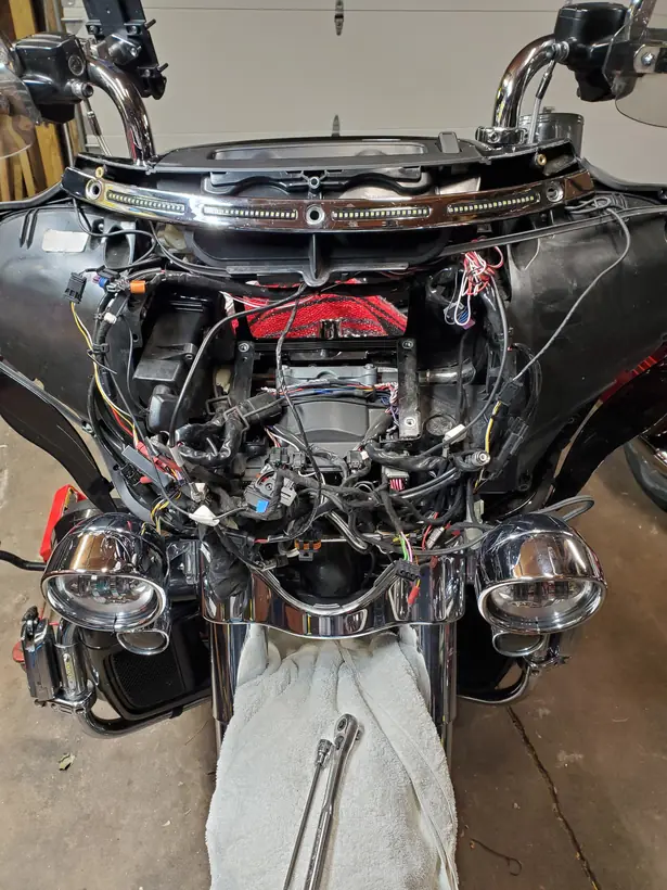 Harley batwing fairing opened up with the wiring and lighting exposed