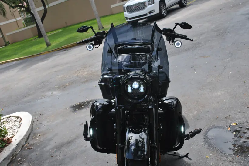 Blacked-out Harley Road King Special from the front with halo turn signals