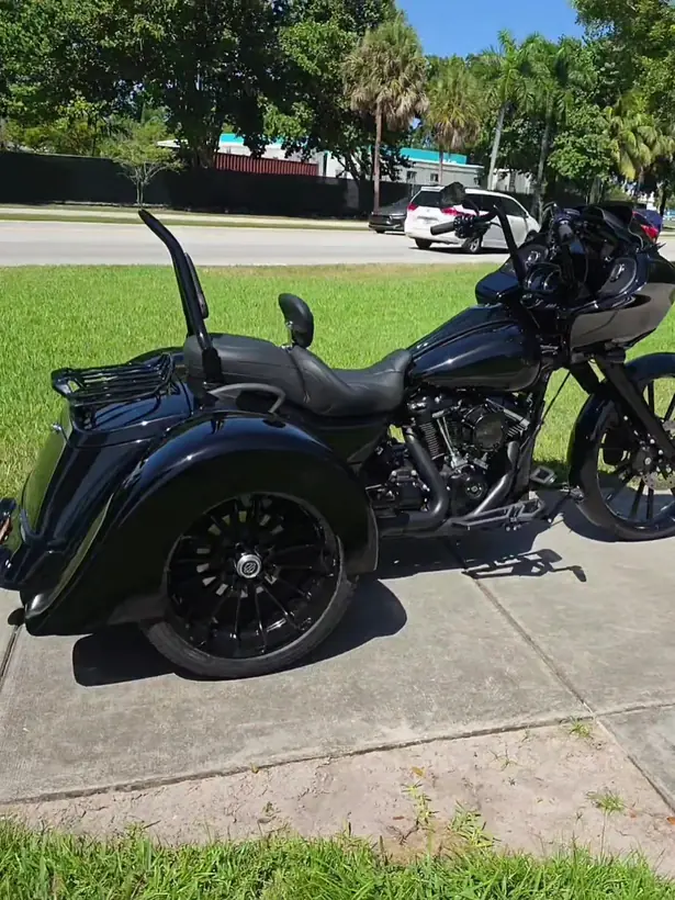 Blacked-out Harley Road Glide trike from the rear quarter
