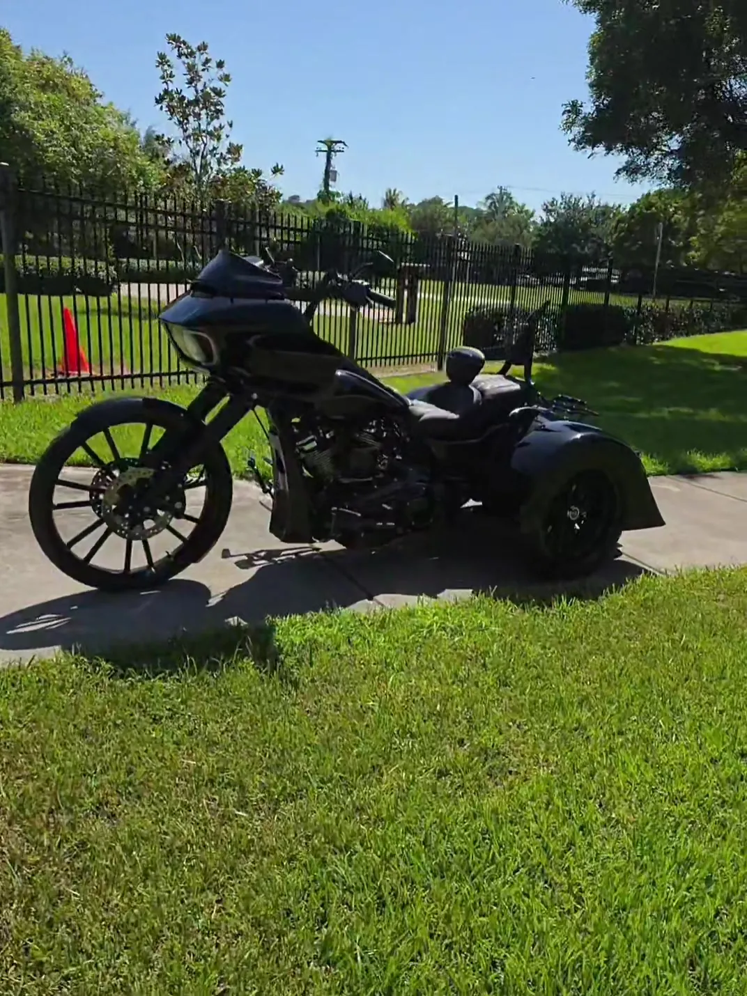 Blacked-out Harley Road Glide trike with black wheels